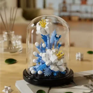 A Paeonia flower made from building blocks in a domed terrarium.