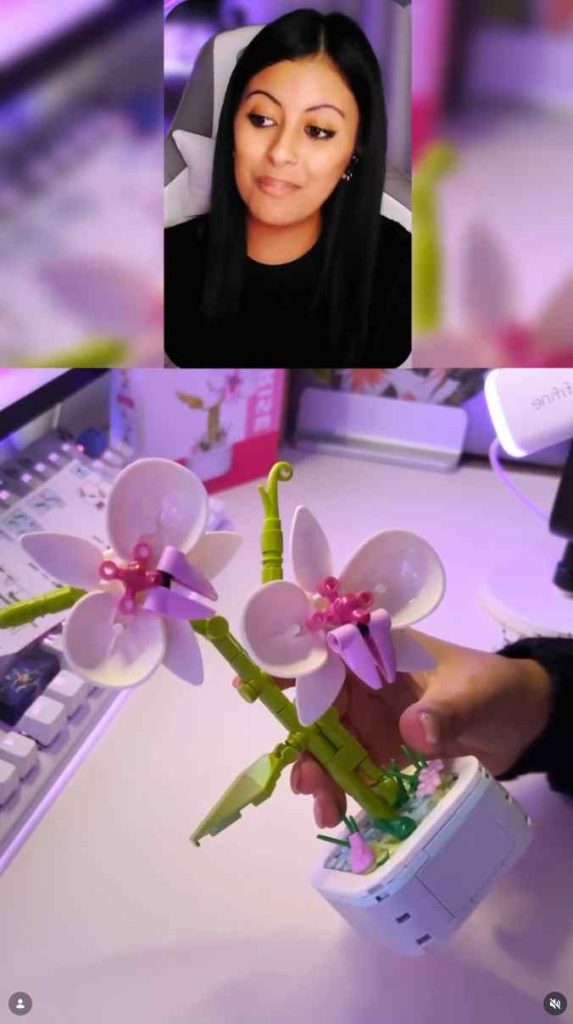 Purple flower building blocks bouquet in front of a camera
